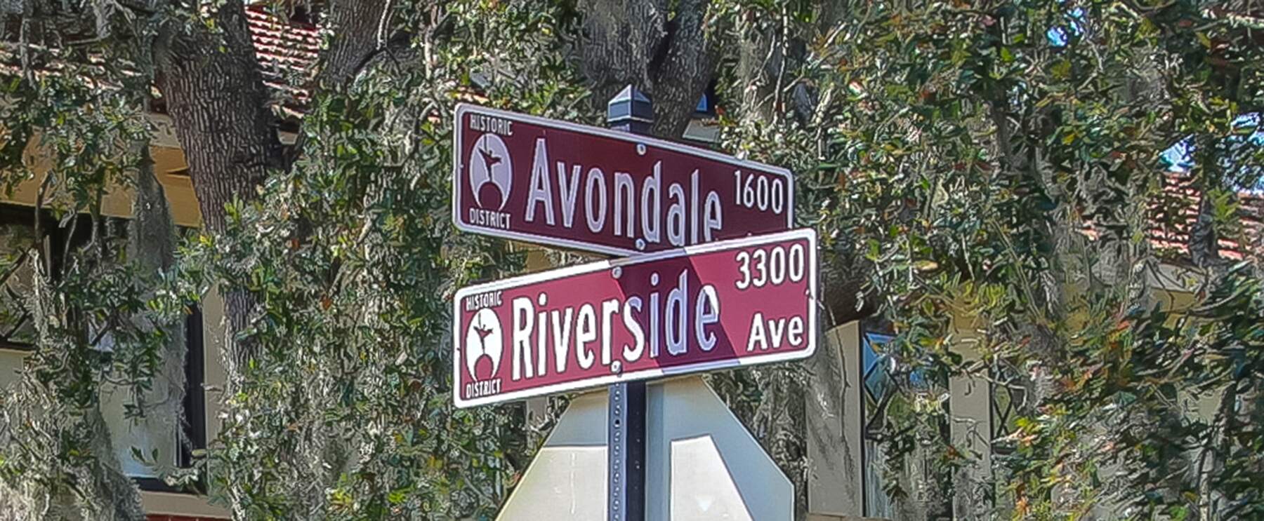 Two Maroon Street Signs In Jax Min